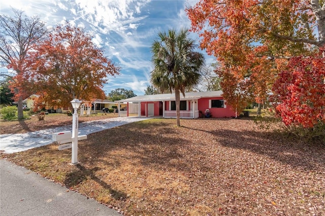 view of front of property with a carport