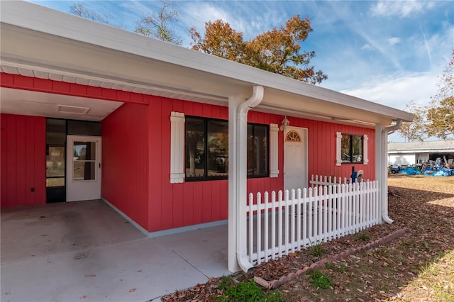 property entrance featuring a patio area