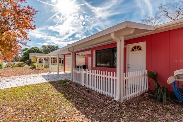 exterior space with a carport