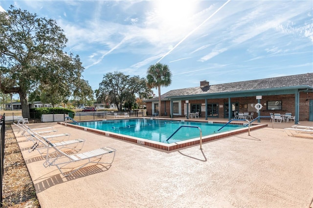 view of swimming pool featuring a patio area