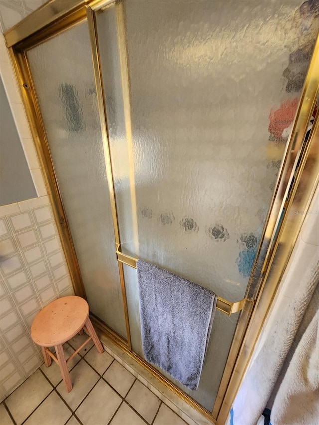 bathroom featuring tile patterned flooring and walk in shower