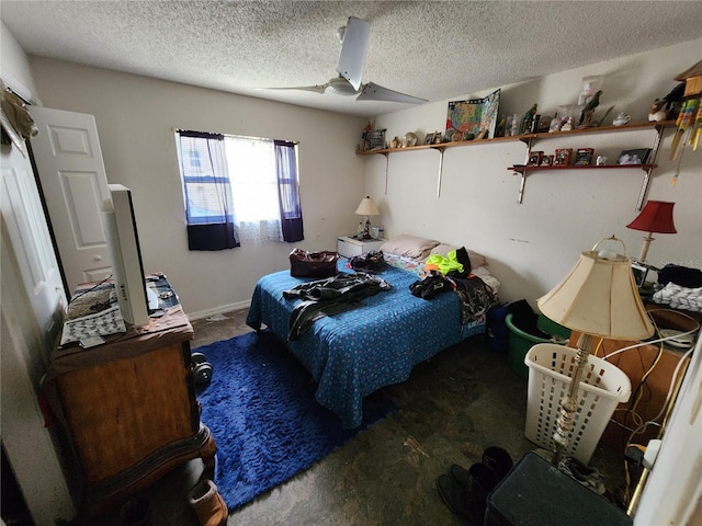 bedroom featuring a textured ceiling and ceiling fan