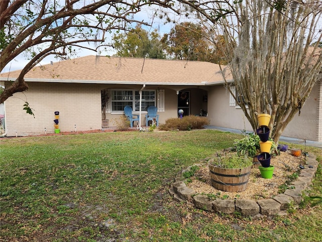 view of front of property with a front lawn