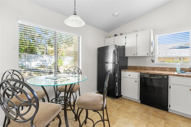 kitchen with white cabinets, pendant lighting, a healthy amount of sunlight, and black appliances