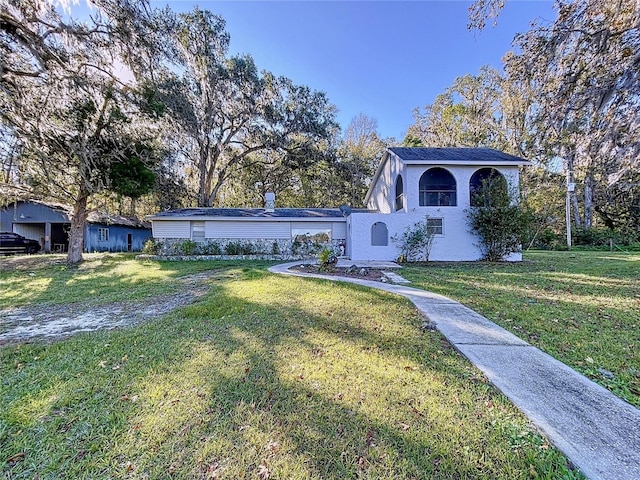 view of front of home with a front yard