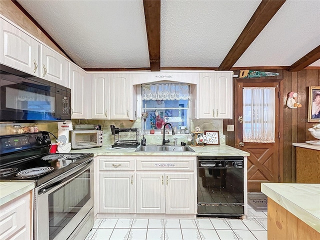 kitchen featuring beamed ceiling, sink, white cabinets, and black appliances