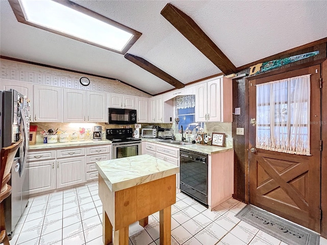 kitchen featuring sink, lofted ceiling with beams, white cabinetry, and black appliances