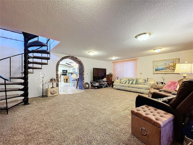 living room with carpet and a textured ceiling