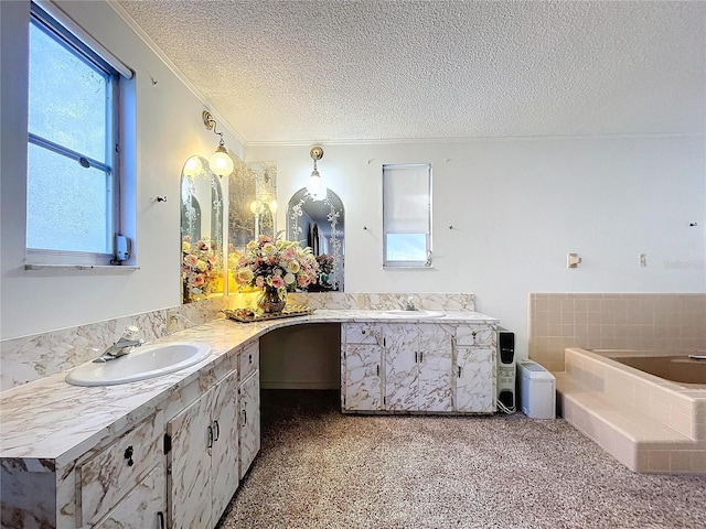 bathroom with crown molding, vanity, a relaxing tiled tub, and a textured ceiling