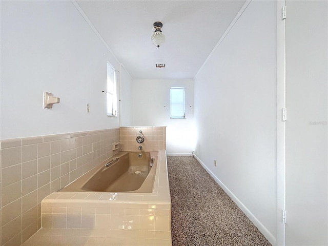 bathroom with crown molding, sink, and a bath