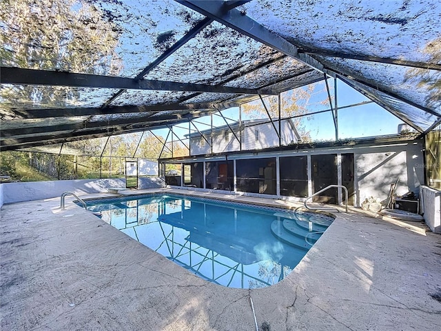 view of pool featuring a lanai and a patio