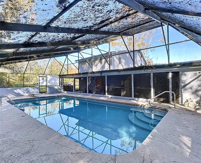 view of pool with a lanai