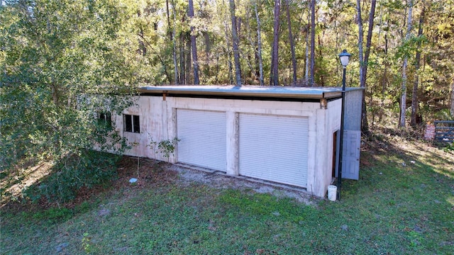 garage featuring a yard