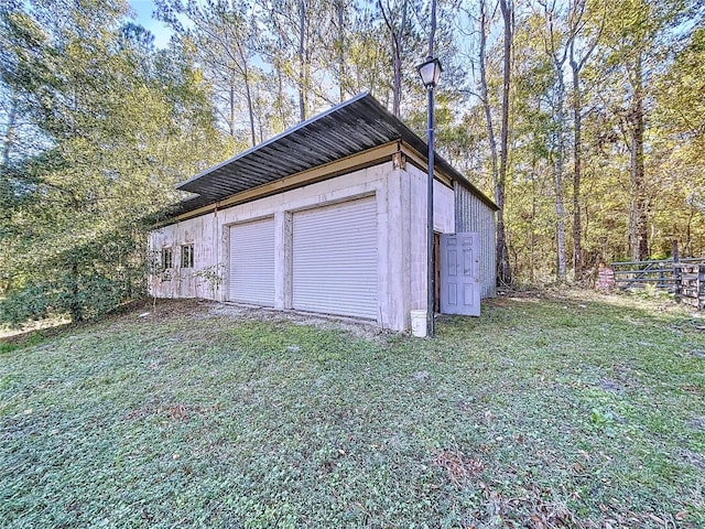 garage with a lawn