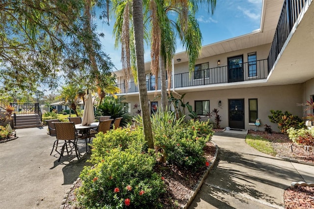 view of property's community featuring a patio