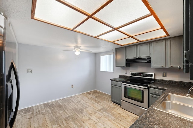 kitchen featuring gray cabinetry, light hardwood / wood-style floors, sink, and appliances with stainless steel finishes