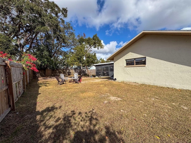 view of yard featuring a sunroom