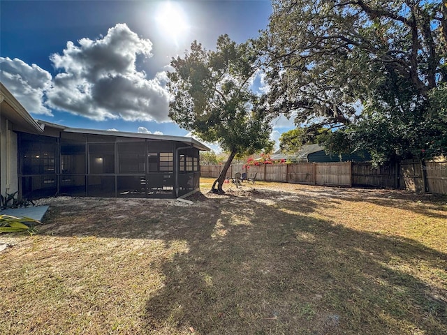 view of yard featuring a sunroom