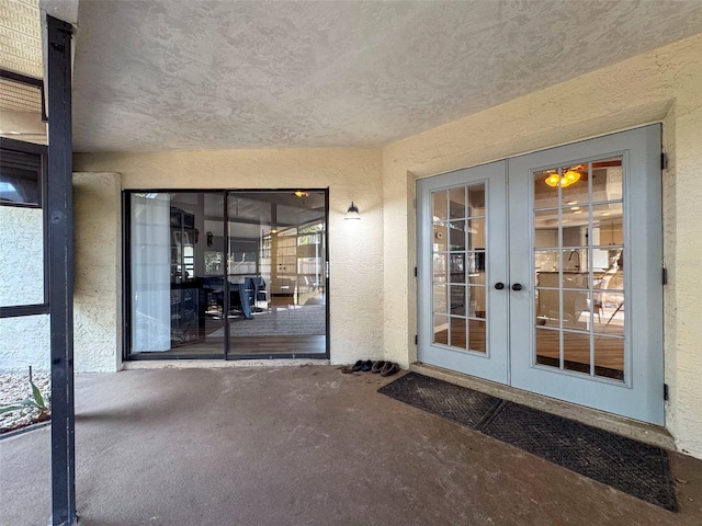 property entrance featuring french doors