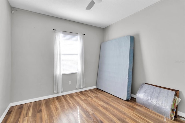 spare room with ceiling fan and hardwood / wood-style floors