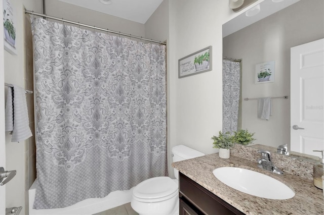 full bathroom featuring tile patterned floors, vanity, toilet, and shower / bath combo with shower curtain