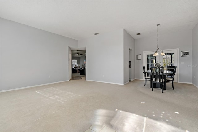 interior space with a high ceiling and a chandelier