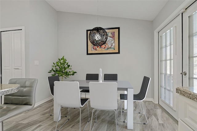 dining space featuring light hardwood / wood-style flooring