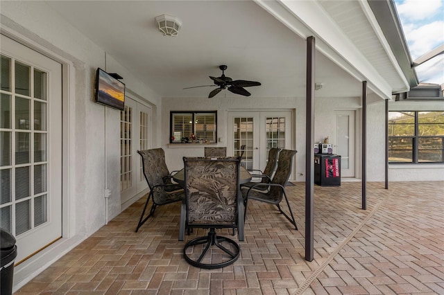 sunroom featuring french doors and ceiling fan