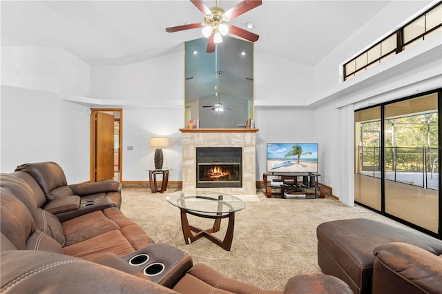 living room featuring carpet, ceiling fan, a fireplace, and high vaulted ceiling