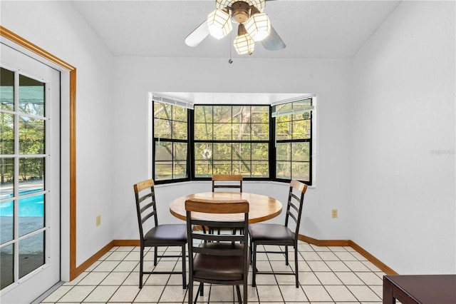 tiled dining area featuring ceiling fan