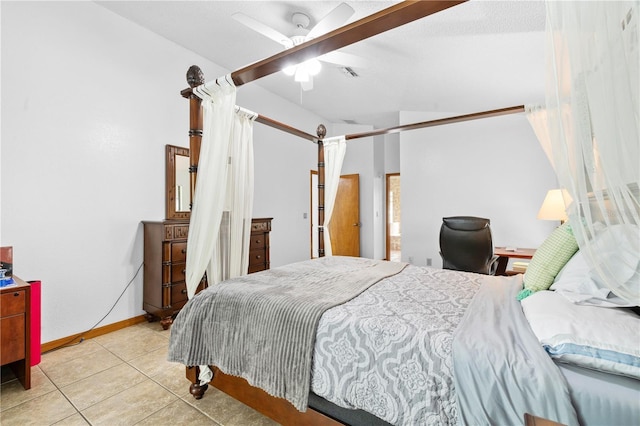 bedroom with ceiling fan and light tile patterned floors