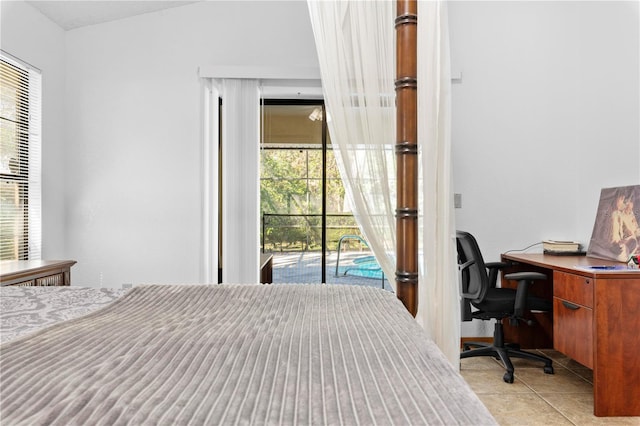 7443 Oak Tree Ln, Spring Hill, FL 34607 - bedroom featuring access to outside, light tile patterned floors, and an office area