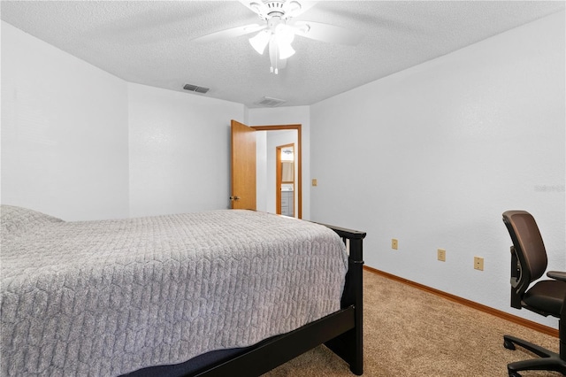 carpeted bedroom with ceiling fan and a textured ceiling