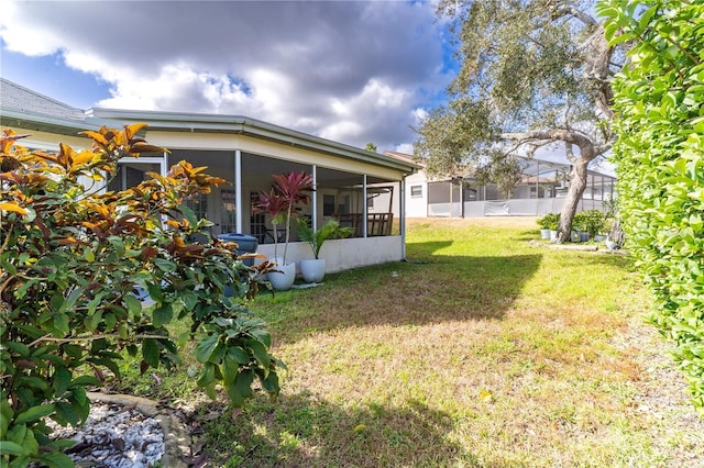 view of yard with a sunroom