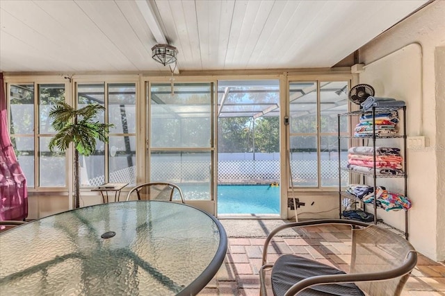 sunroom featuring a wealth of natural light and wooden ceiling