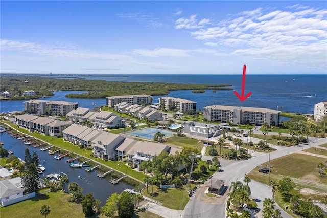 birds eye view of property with a water view