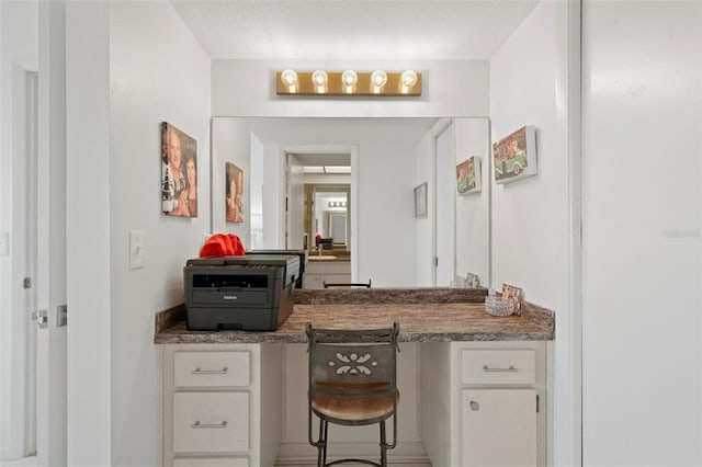 bathroom featuring vanity and a textured ceiling