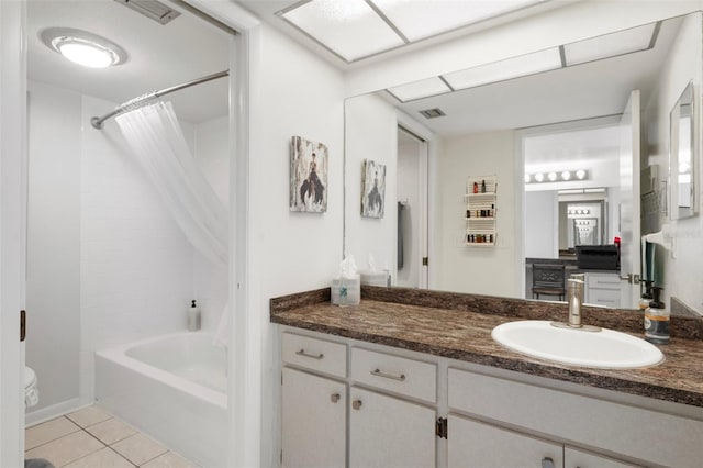 full bathroom featuring tile patterned flooring, vanity, shower / bath combo, and toilet