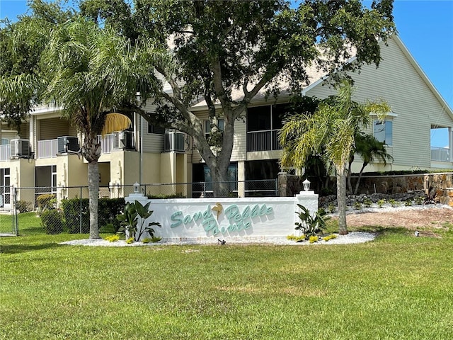 view of swimming pool featuring a lawn and central AC