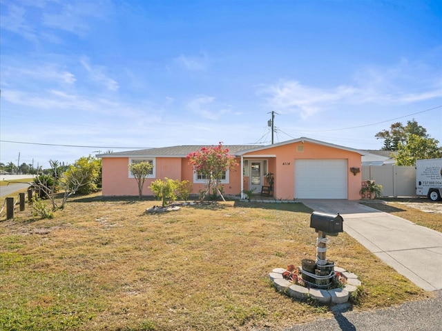 single story home featuring a garage and a front lawn