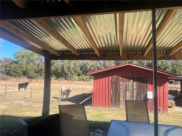 view of patio with a storage shed