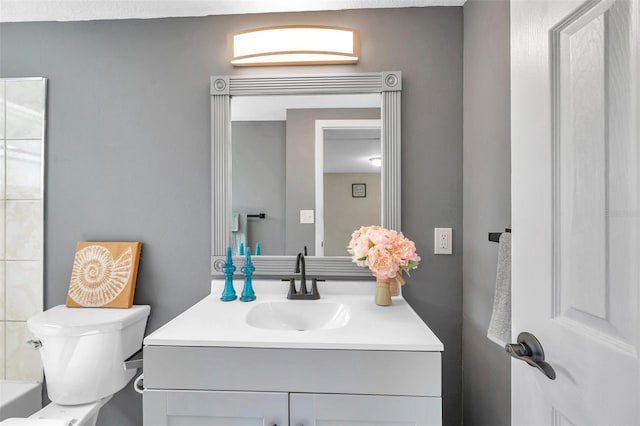 bathroom featuring vanity and toilet