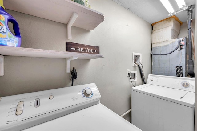 laundry area with washing machine and clothes dryer