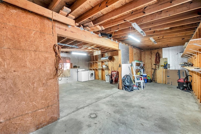 basement featuring independent washer and dryer and a workshop area