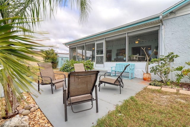 view of patio / terrace with a sunroom