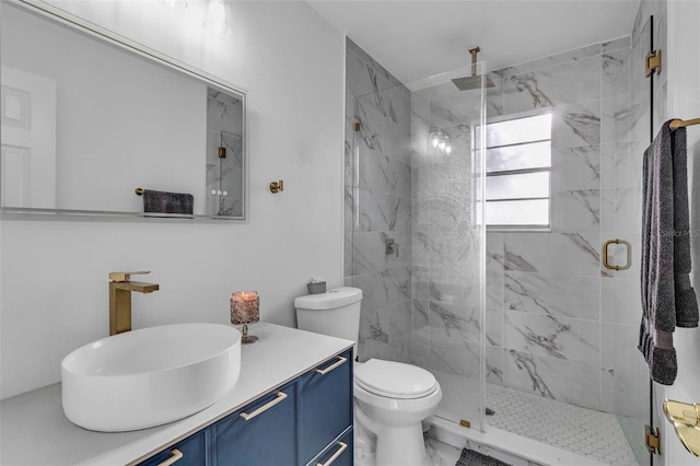 bathroom with vanity, toilet, and walk in shower