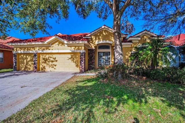 mediterranean / spanish-style house with concrete driveway, a tiled roof, an attached garage, and stucco siding