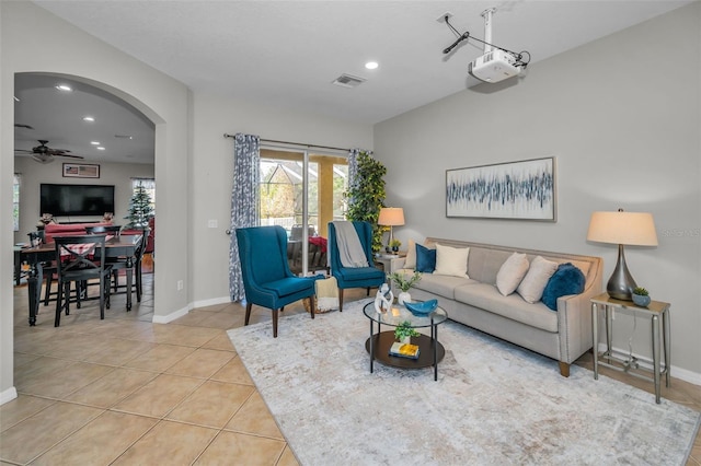 11645 Belle Haven Dr, New Port Richey, FL 34654 - living room with a ceiling fan, tile patterned flooring, arched walkways, recessed lighting, and baseboards