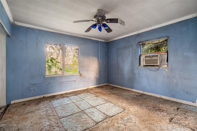 spare room with ceiling fan, plenty of natural light, cooling unit, and crown molding