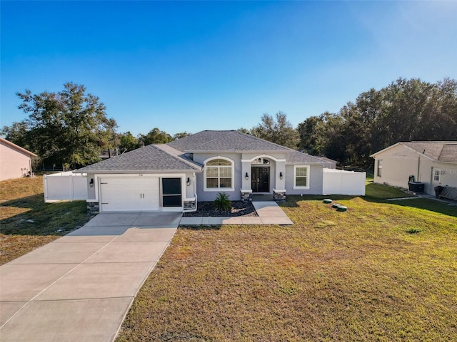 view of front of property with a front lawn and a garage